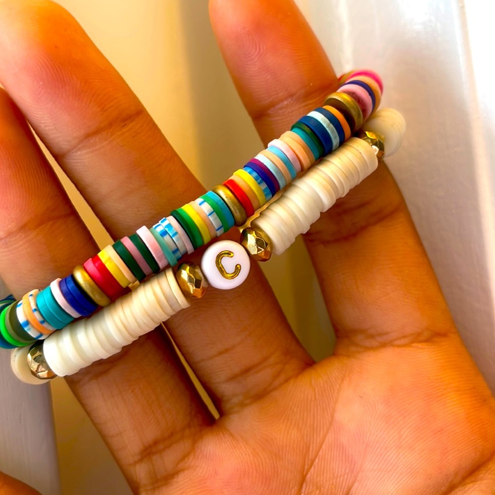White custom initial Braclet with tag along colorful on very stretchy and nice!!